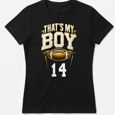 Bold typography t-shirt with text 'That's My Boy 14' in gold, black, and white — printed on a women's shirt
