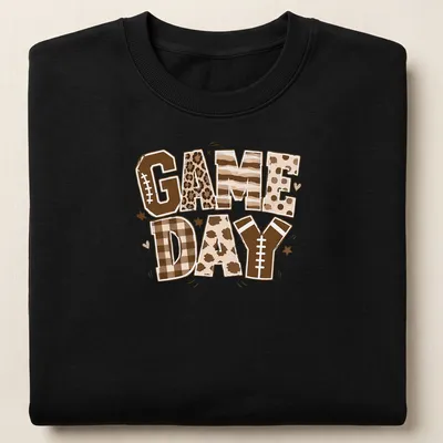 Retro football-themed t-shirt with bold 'Game Day' lettering and colors of brown and cream — printed on a unisex sweatshirt