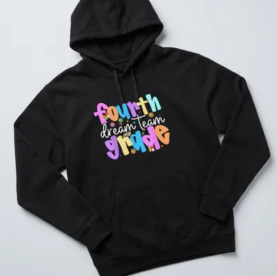Colorful playful design featuring 'fourth grade dream team' text in bright colors — printed on a unisex hoodie