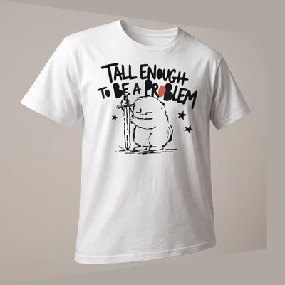 Cartoon character holding a sword with text 'Tall Enough To Be A Problem' in black and red — printed on a unisex t-shirt (angled view)