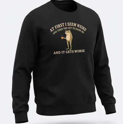 Whimsical illustration of a frog holding a coffee mug with funny text — printed on a unisex sweatshirt