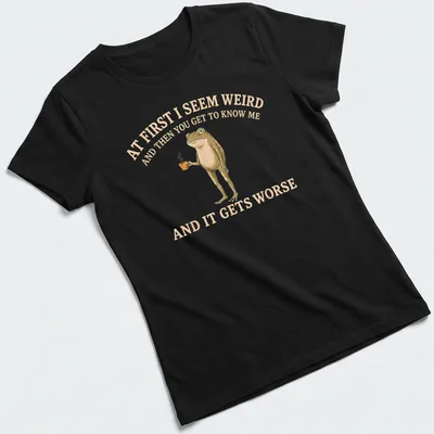 Whimsical illustration of a frog holding a coffee mug with funny text — printed on a women's shirt
