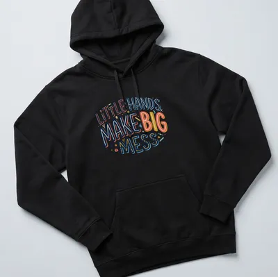 Playful typography shirt with text 'Little Hands Make Big Mess' in bright colors. — printed on a unisex hoodie