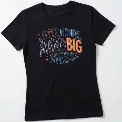 Playful typography shirt with text 'Little Hands Make Big Mess' in bright colors. — printed on a women's shirt