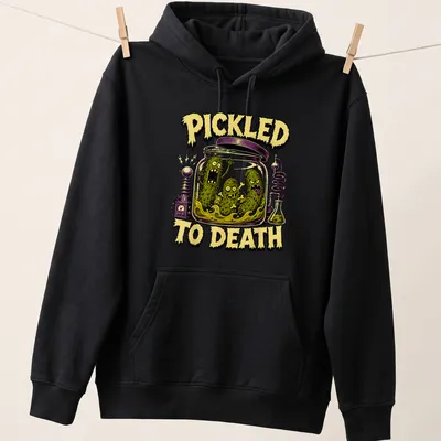 Comic style graphic of pickles with the text 'PICKLED TO DEATH' in Halloween colors — printed on a unisex hoodie