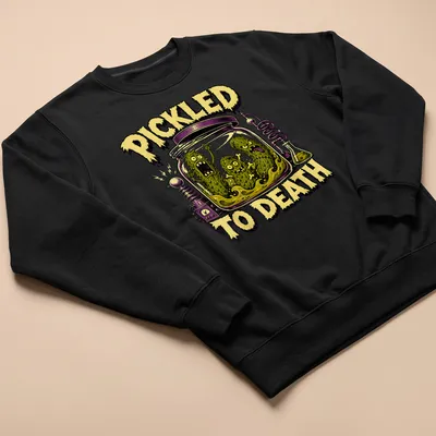 Comic style graphic of pickles with the text 'PICKLED TO DEATH' in Halloween colors — printed on a unisex sweatshirt