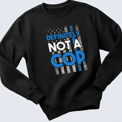 Bold design with humorous police flag and text reading Definitely Not A Cop — printed on a unisex sweatshirt