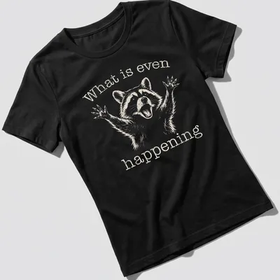 Vintage distressed Funny Raccoon t-shirt with the text 'What is even happening' — printed on a women's shirt