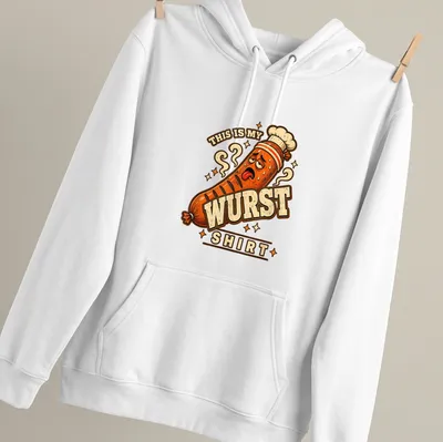 Cartoon sausage with text saying 'THIS IS MY WURST SHIRT' in orange, brown and cream. — printed on a unisex hoodie