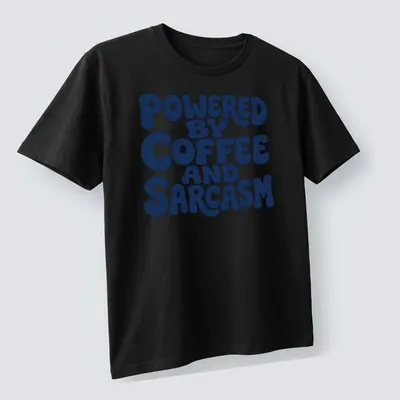 Bold typography shirt with the quote 'Powered By Coffee And Sarcasm' in navy and white — printed on a unisex t-shirt (angled view)