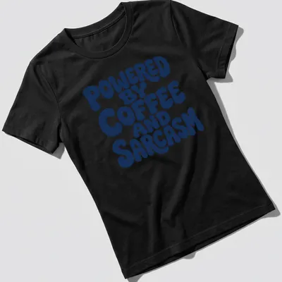 Bold typography shirt with the quote 'Powered By Coffee And Sarcasm' in navy and white — printed on a women's shirt