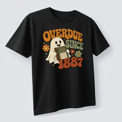 Retro graphic of a ghost holding an overdue library book with colorful text — printed on a unisex t-shirt (angled view)