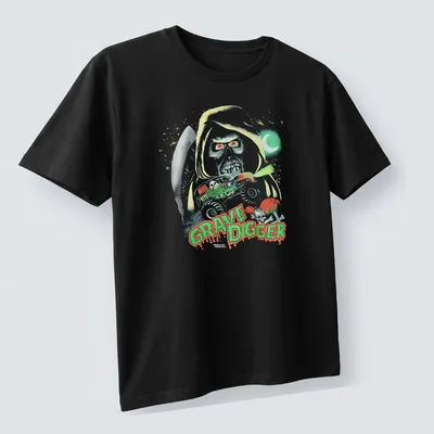 Halloween-themed Grave Digger monster truck graphic in green, red, black, and white — printed on a unisex t-shirt (angled view)
