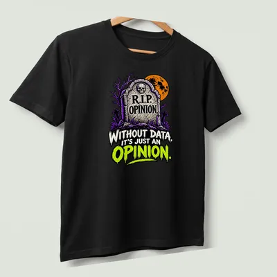 Cartoon gravestone graphic with humorous text about data and opinion in Halloween colors — printed on a unisex t-shirt (angled view)