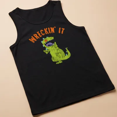 Playful illustration of a green dinosaur with the text WRECKIN' IT — printed on a tank top