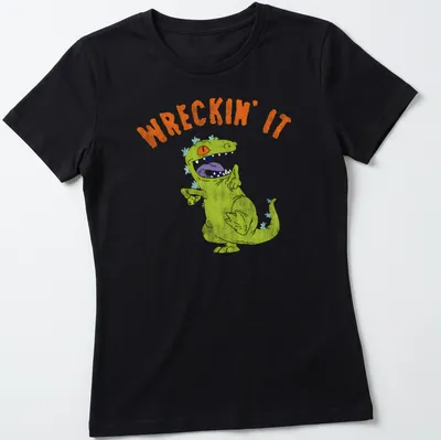 Playful illustration of a green dinosaur with the text WRECKIN' IT — printed on a women's shirt