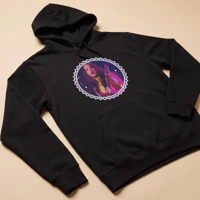 Vintage concert style Guts Tour t-shirt featuring a female guitarist in bold colors — printed on a unisex hoodie