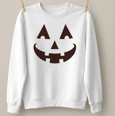 Simple graphic of a happy pumpkin face on a black t-shirt for Halloween — printed on a unisex sweatshirt