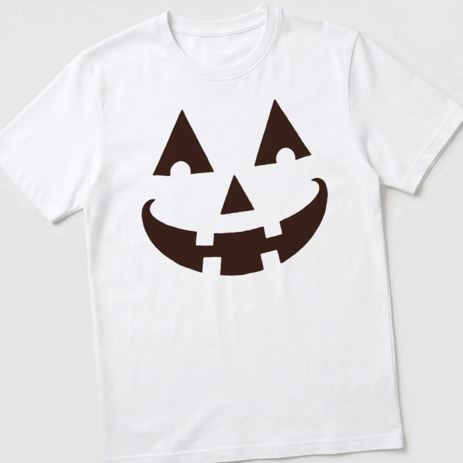Simple graphic of a happy pumpkin face on a black t-shirt for Halloween — printed on a unisex t-shirt