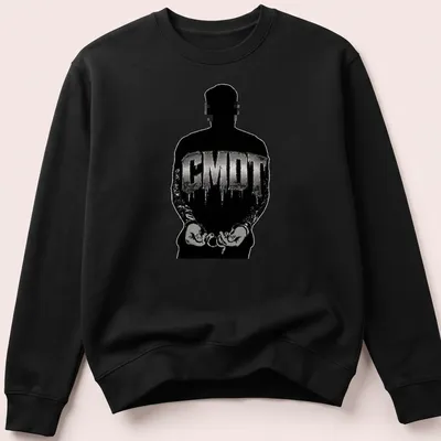 Urban streetwear t-shirt featuring a handcuffed silhouette and CMDT text in black and silver — printed on a unisex sweatshirt