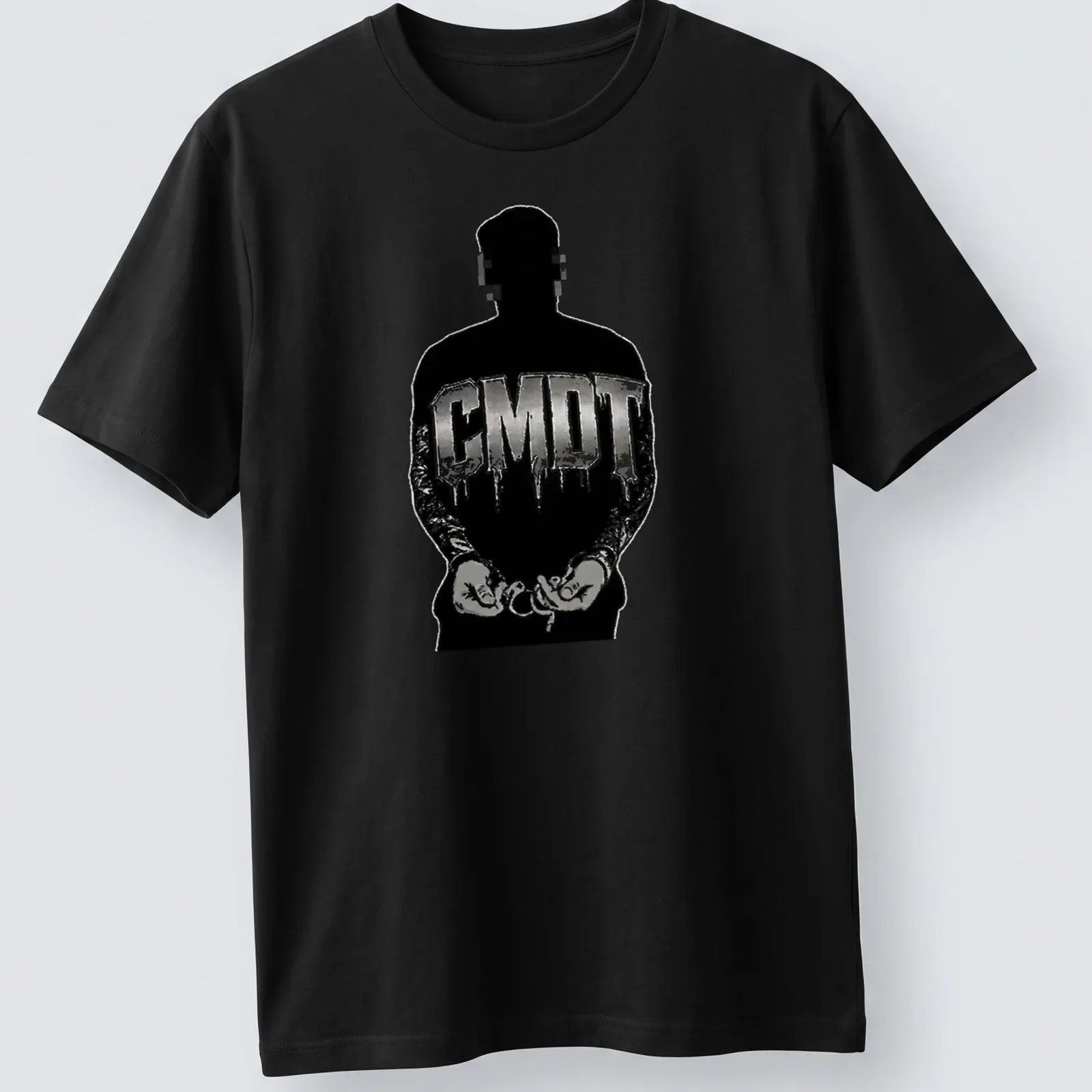 Urban streetwear t-shirt featuring a handcuffed silhouette and CMDT text in black and silver — printed on a unisex t-shirt