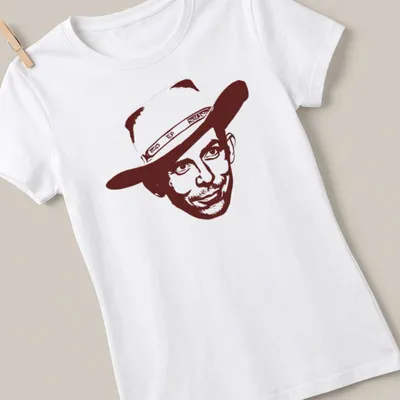 Retro vintage T-shirt featuring Hank Williams in brown and white — printed on a women's shirt