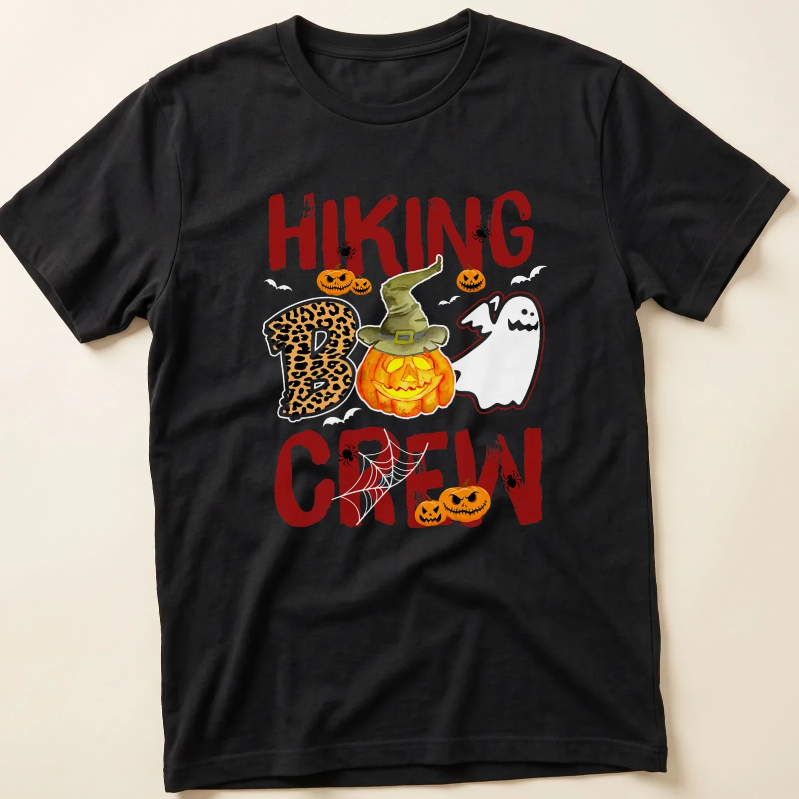 Playful cartoon design of a pumpkin and ghost for Halloween — printed on a unisex t-shirt