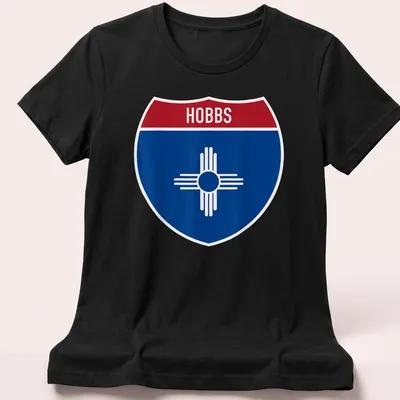 Hobbs New Mexico highway sign t-shirt in shield design with blue, red, and white colors — printed on a women's shirt