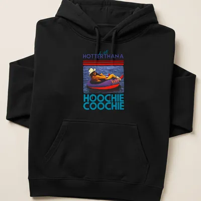 Retro colorful t-shirt with the phrase 'it gets HOTTERTHANA HOOCHIE COOCHIE' and a person on a float — printed on a unisex hoodie