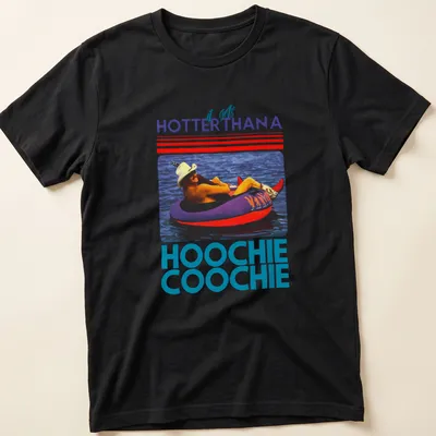 Retro colorful t-shirt with the phrase 'it gets HOTTERTHANA HOOCHIE COOCHIE' and a person on a float — printed on a unisex t-shirt