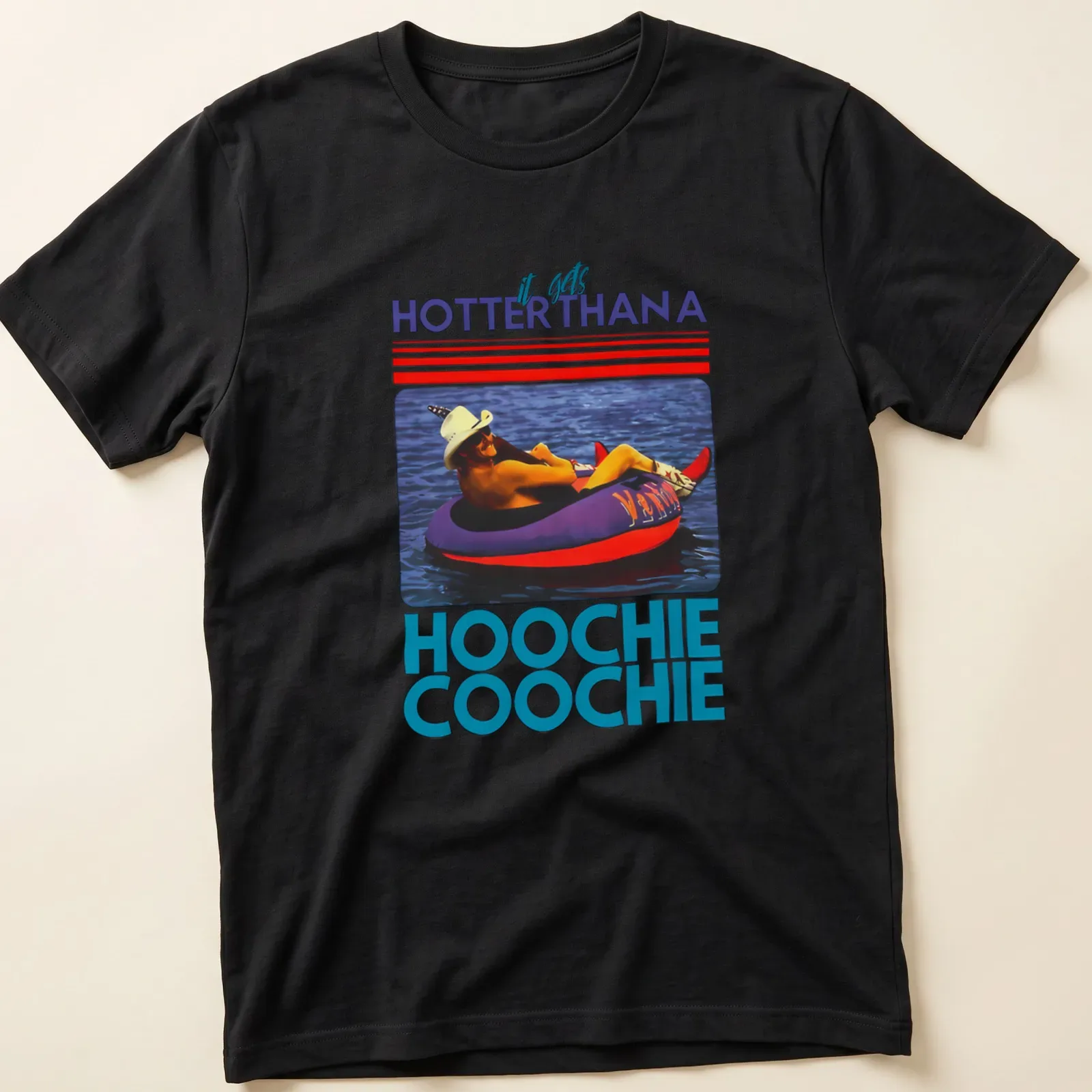 Retro colorful t-shirt with the phrase 'it gets HOTTERTHANA HOOCHIE COOCHIE' and a person on a float — printed on a unisex t-shirt