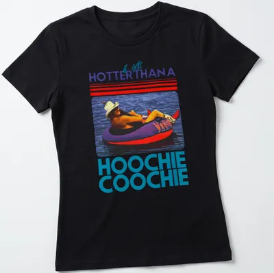 Retro colorful t-shirt with the phrase 'it gets HOTTERTHANA HOOCHIE COOCHIE' and a person on a float — printed on a women's shirt