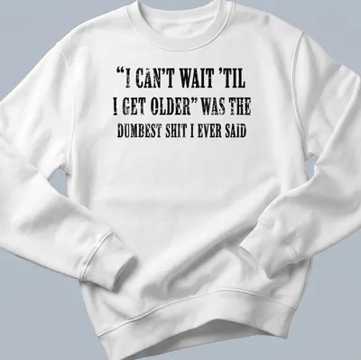 Distressed black text on white tee humorously reflecting on aging. — printed on a unisex sweatshirt