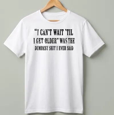 Distressed black text on white tee humorously reflecting on aging.