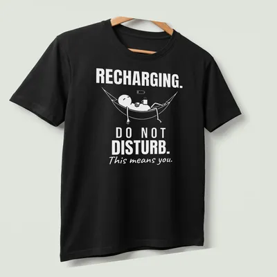 Funny typography tee showing a person relaxing in a hammock with a do not disturb message. — printed on a unisex t-shirt (angled view)