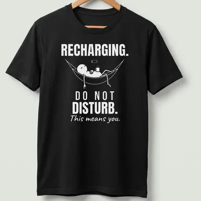 Funny typography tee showing a person relaxing in a hammock with a do not disturb message. — printed on a unisex t-shirt
