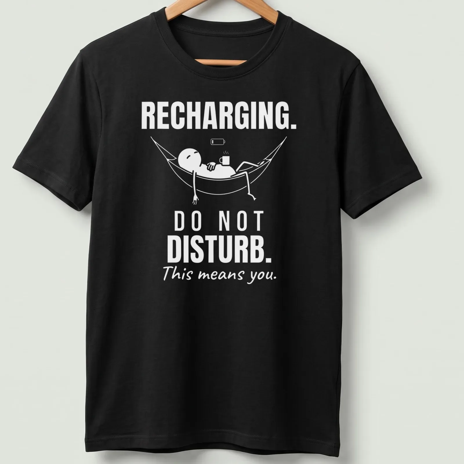 Funny typography tee showing a person relaxing in a hammock with a do not disturb message. — printed on a unisex t-shirt