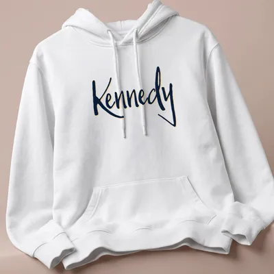 Elegant script shirt featuring the name Kennedy in gold on navy blue — printed on a unisex hoodie