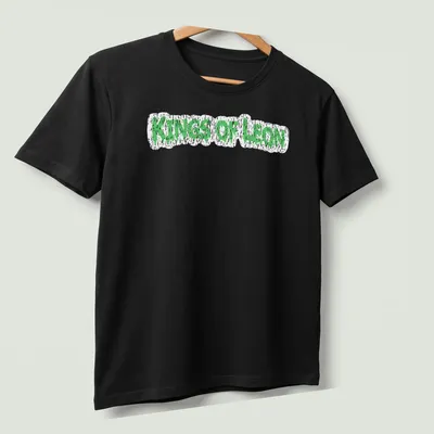 Grunge-style Kings Of Leon t-shirt with green dripping text design — printed on a unisex t-shirt (angled view)