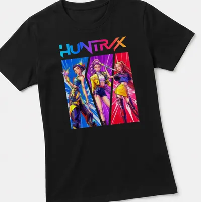 Retro print of Kpop Demon Hunters with bold HUNTRX text in vibrant colors — printed on a women's shirt