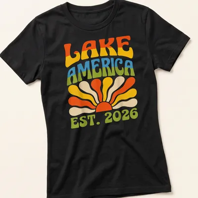 Retro vintage Lake America t-shirt featuring a sunset design with vibrant colors — printed on a women's shirt