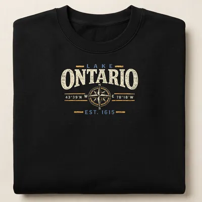 Vintage design featuring compass coordinates for Lake Ontario in cream, blue, and gold — printed on a unisex sweatshirt