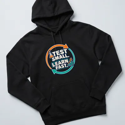 Bold graphic tee with 'TEST SMALL. LEARN FAST.' and laboratory flask illustration — printed on a unisex hoodie