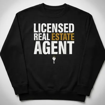 Licensed Real Estate Agent t-shirt featuring bold typography and a key graphic. — printed on a unisex sweatshirt