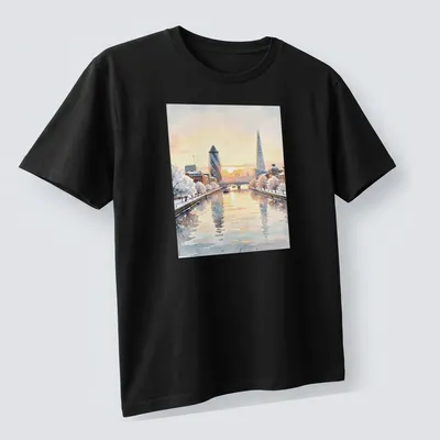 Watercolor illustration of the London skyline featuring The Shard and Gherkin. — printed on a unisex t-shirt (angled view)