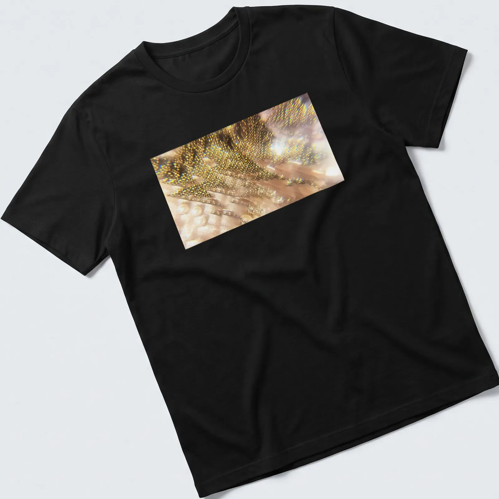 Prism-style graphic of Firebird feathers in gold, pink, and white — printed on a unisex t-shirt