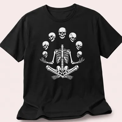 Halloween-themed t-shirt featuring a meditating skeleton with playful skulls.