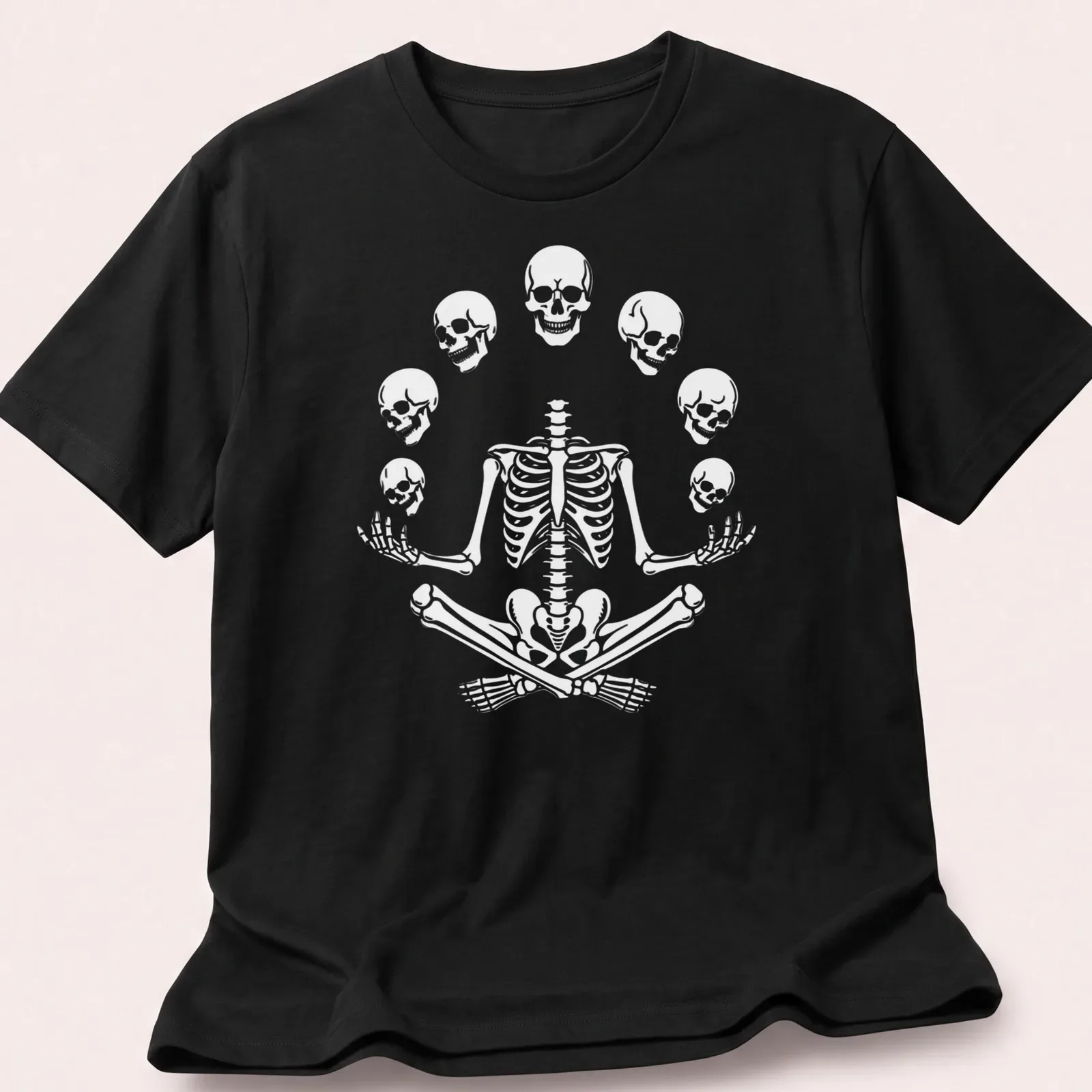 Halloween-themed t-shirt featuring a meditating skeleton with playful skulls. — printed on a unisex t-shirt