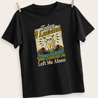 Vintage distressed shirt featuring a mischievous cat and a humorous quote about feline antics