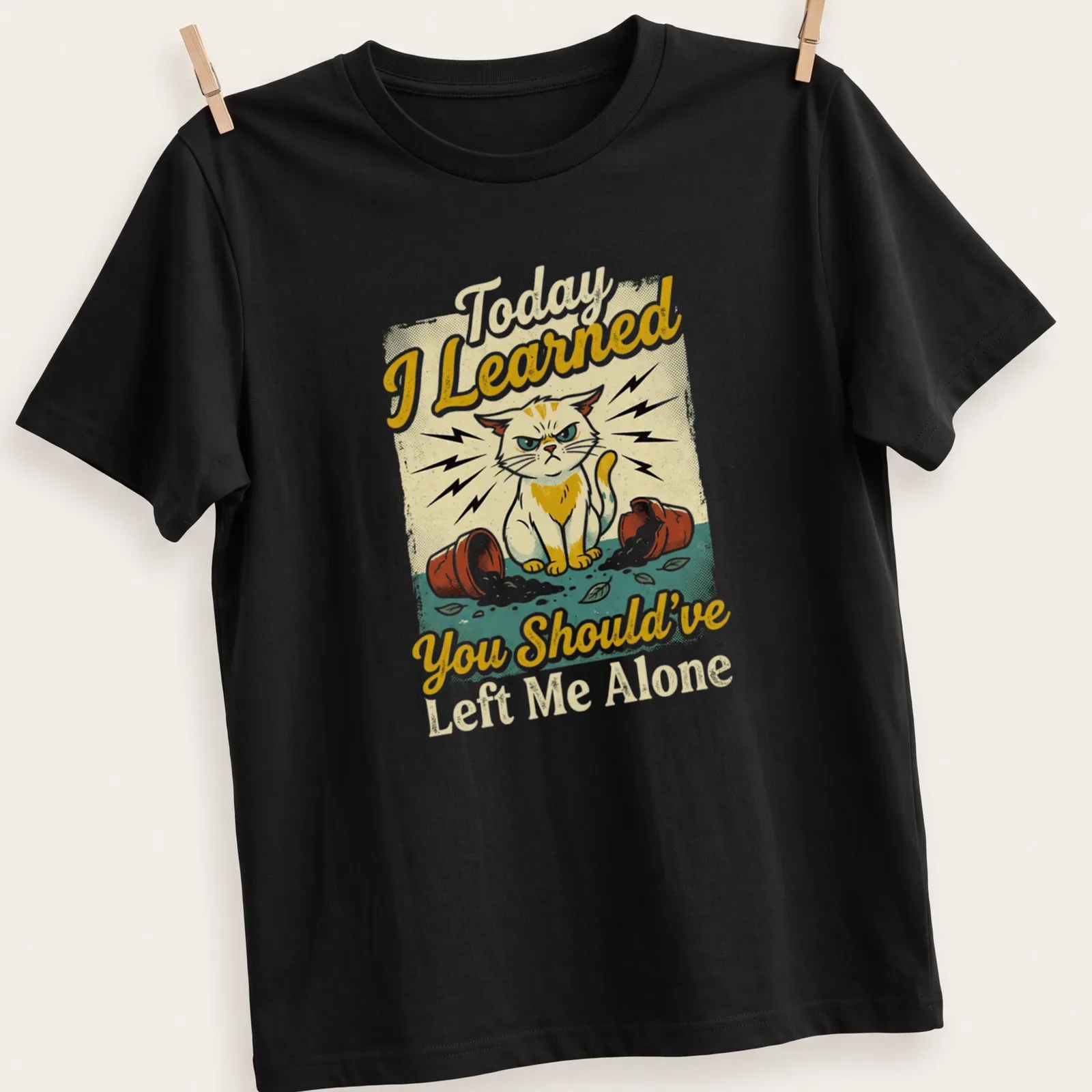 Vintage distressed shirt featuring a mischievous cat and a humorous quote about feline antics — printed on a unisex t-shirt